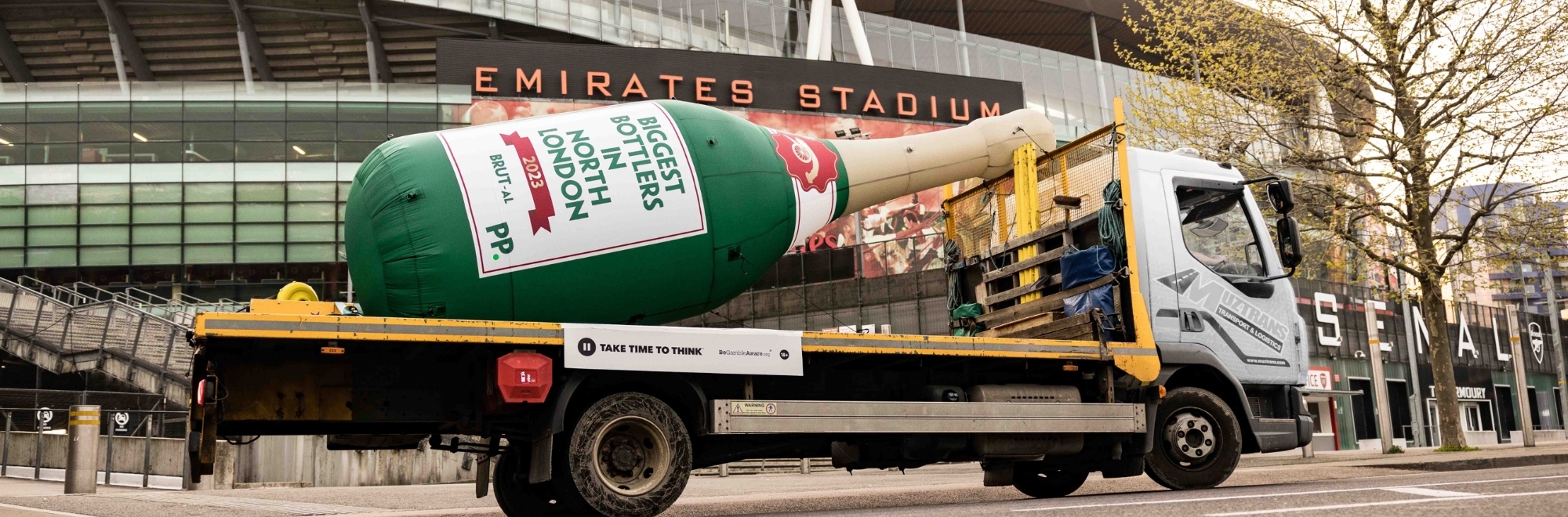 Gunner bottle it: Paddy Power delivers an 18ft bottle to Arsenal following title race collapse