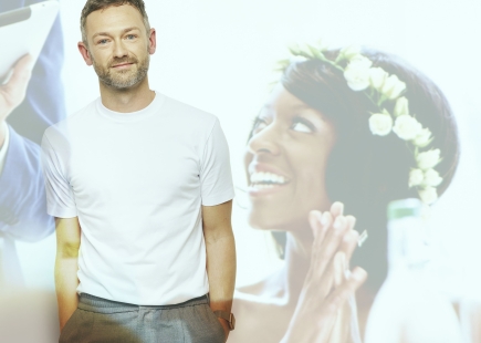 Embargo 16th November 20 Lost for Words A Royal London exhibition with Rankin Ben Brooks Dutton pictured standing next to a projection of his wife who he lost when a car ran off the road