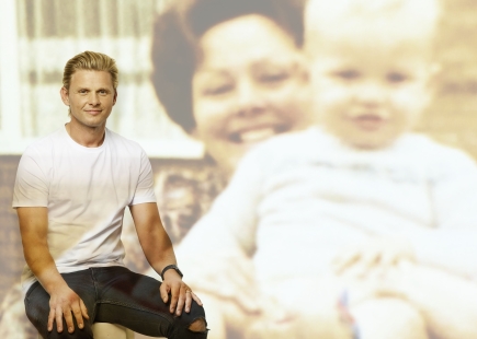Embargo 16th November 20 Lost for Words A Royal London exhibition with Rankin Jeff Brazier pictured standing next to a projection of his grandmother